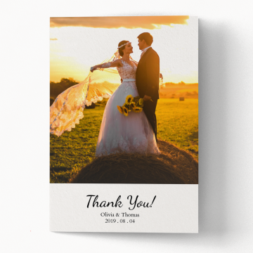 folded thank you card with an image of a bride and groom standing on top of a hay bale