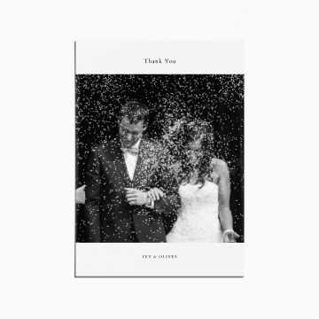thank you card with an image of a married couple walking out of a chapel and getting rice thrown on them