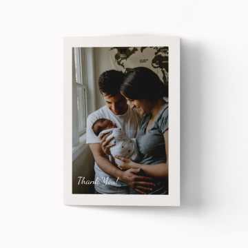 thank you card with an image of parents holding their newborn baby