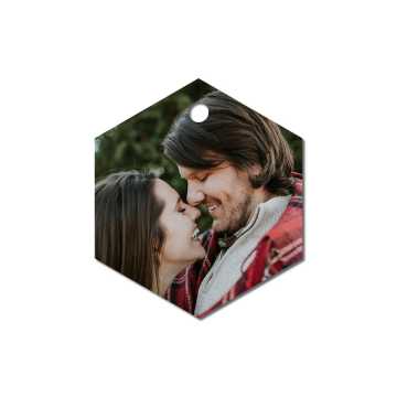 Metal ornament with an image of a couple