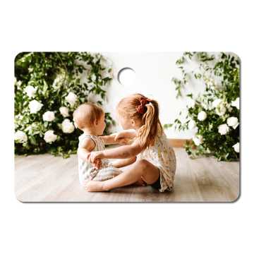 Metal ornament with an image of two small children