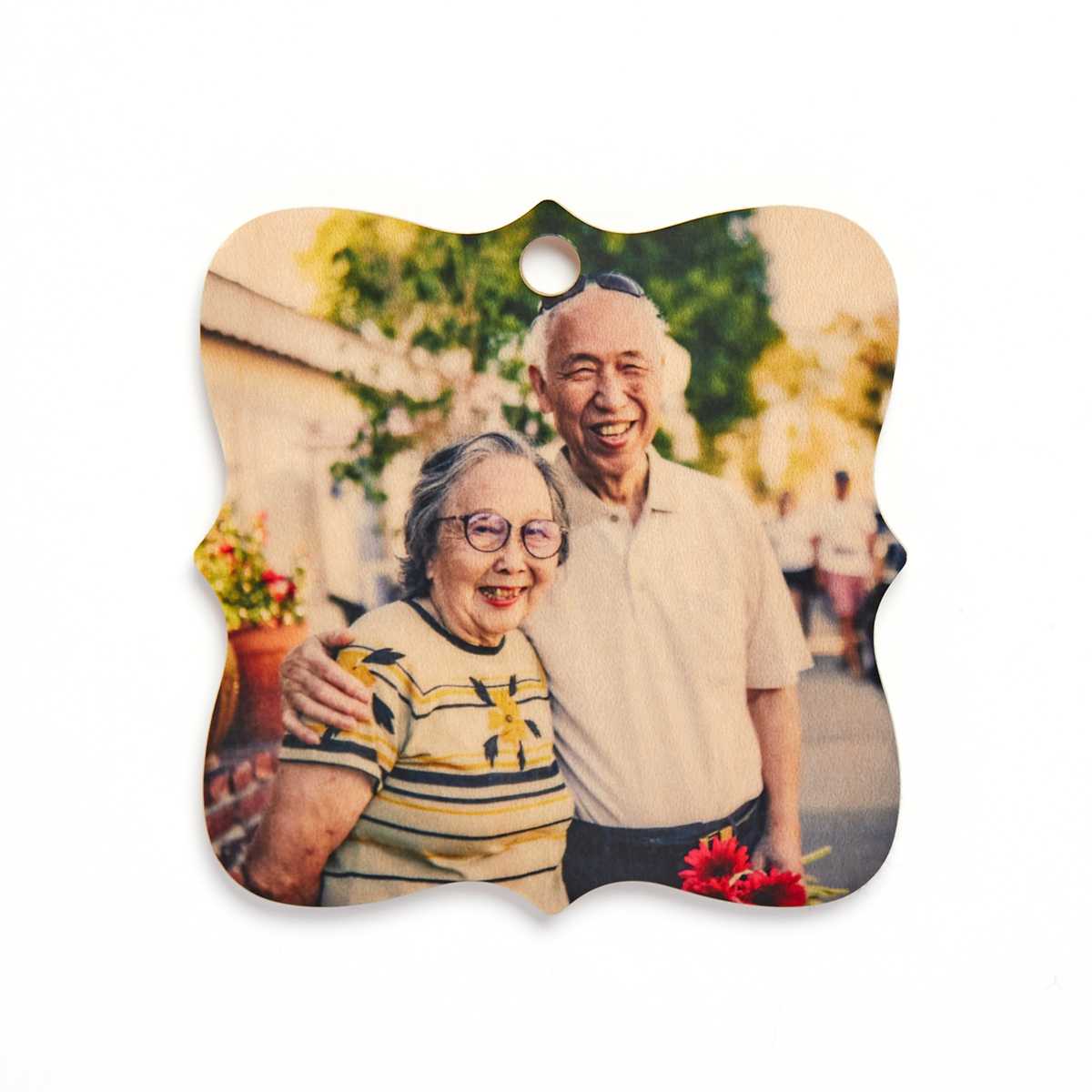 Wooden ornament with an image of a senior couple