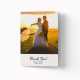 Folded thank you card with an image of a married couple standing on top a hay bale