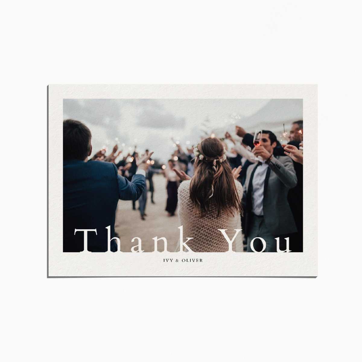 thank you card with an image of wedding guests holding up sparklers