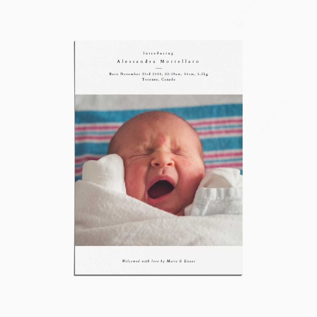Birth announcement card with an image of a newborn baby yawning