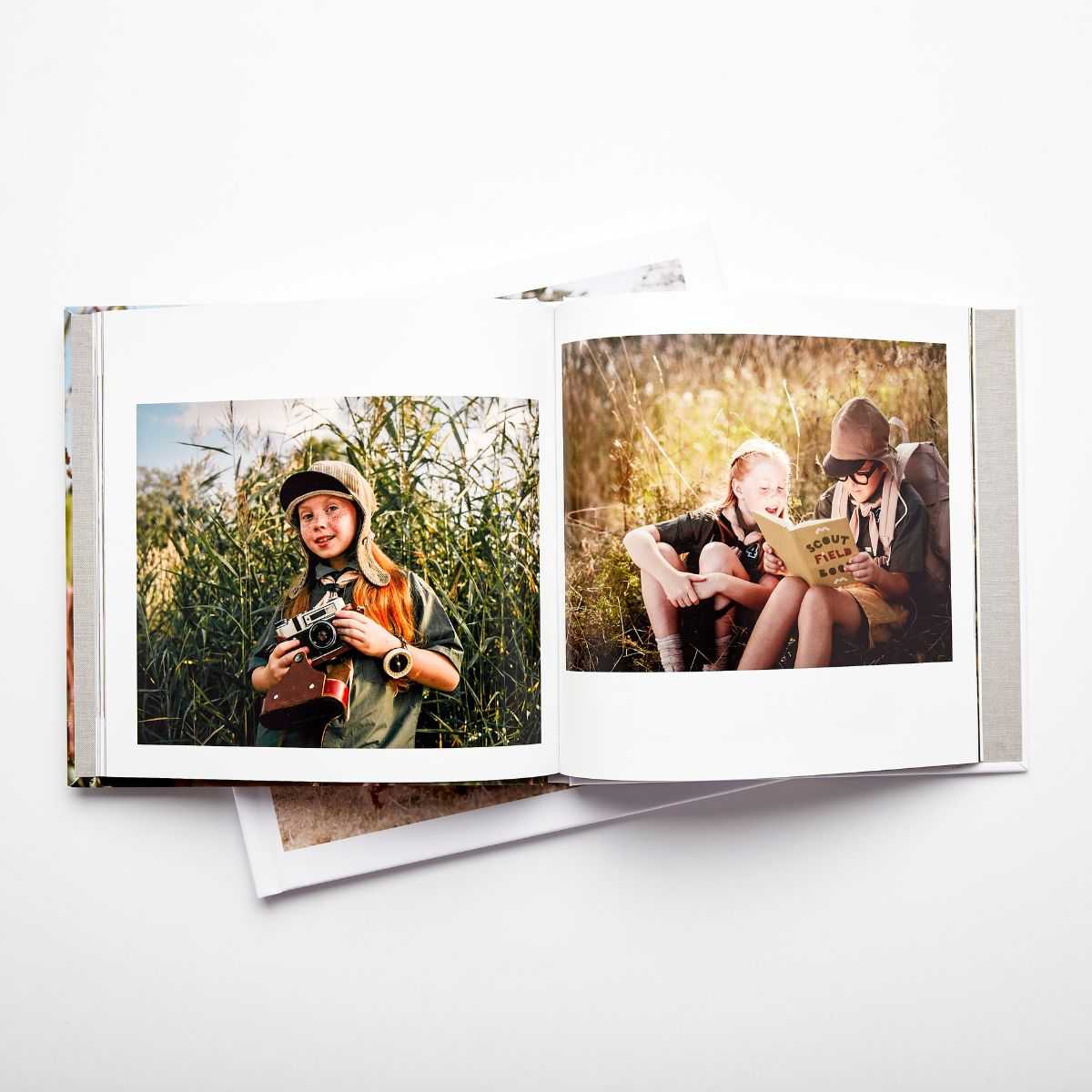 Photo book spread with kids pictures