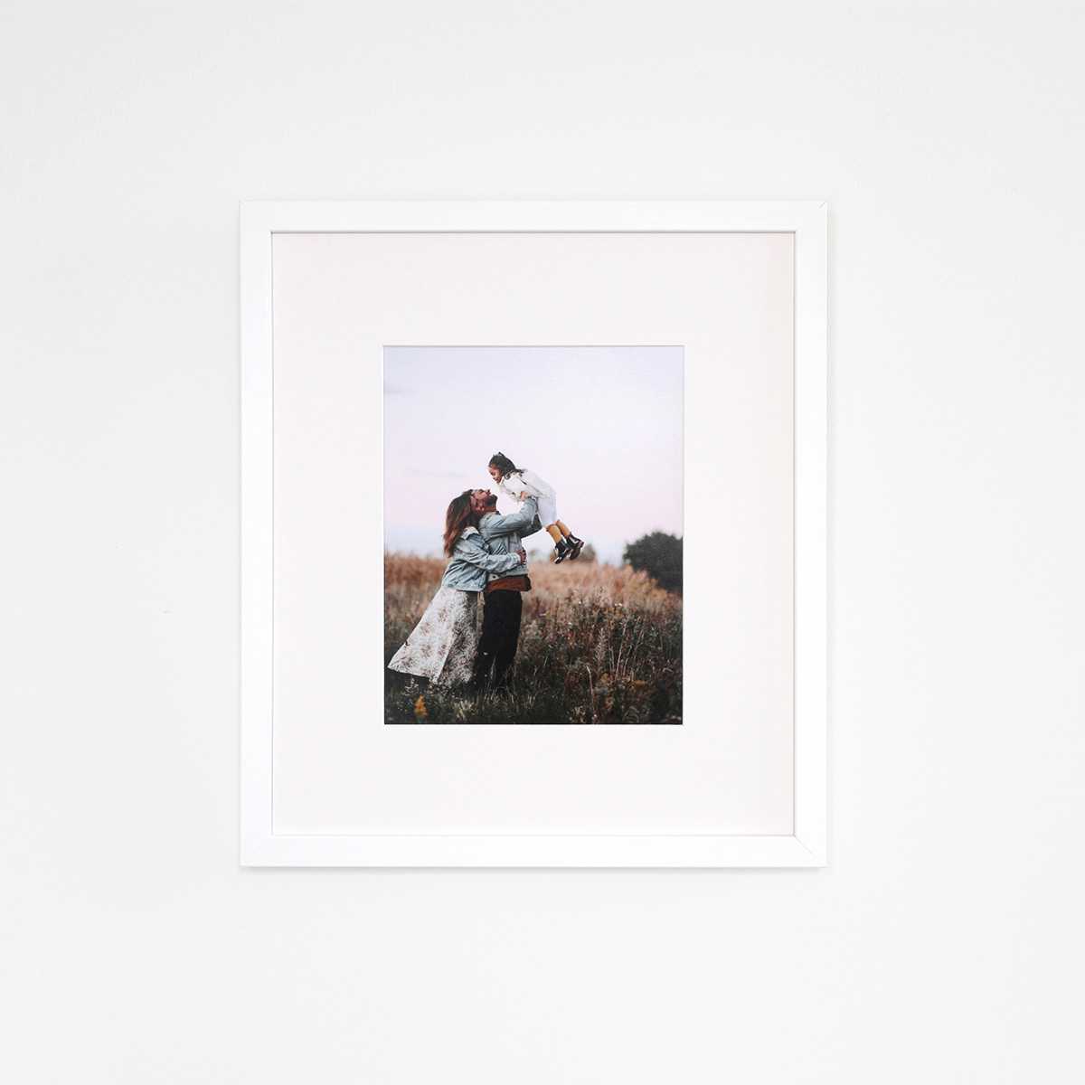 White frame with family photos