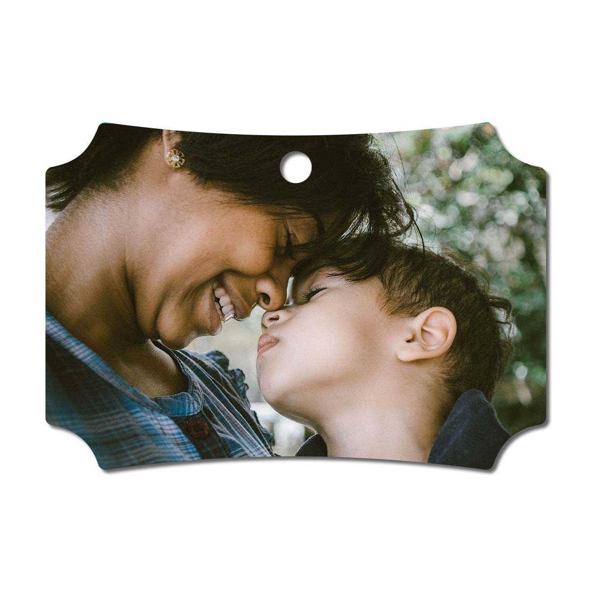 metal ornament with an image of a mother and her child