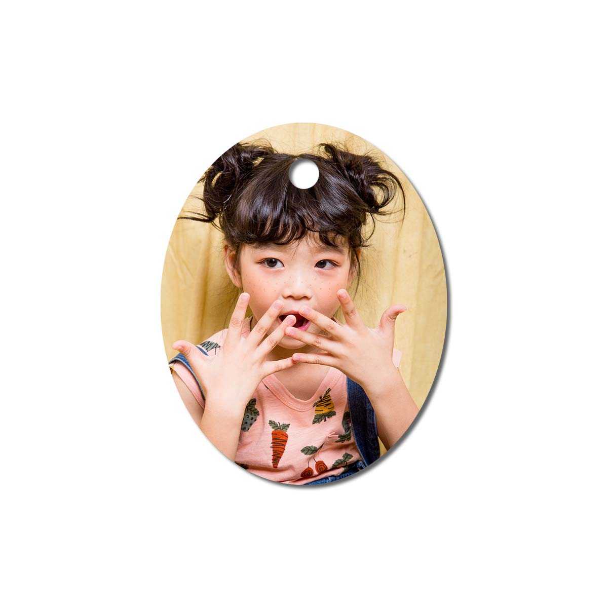 Metal ornament with an image of a child