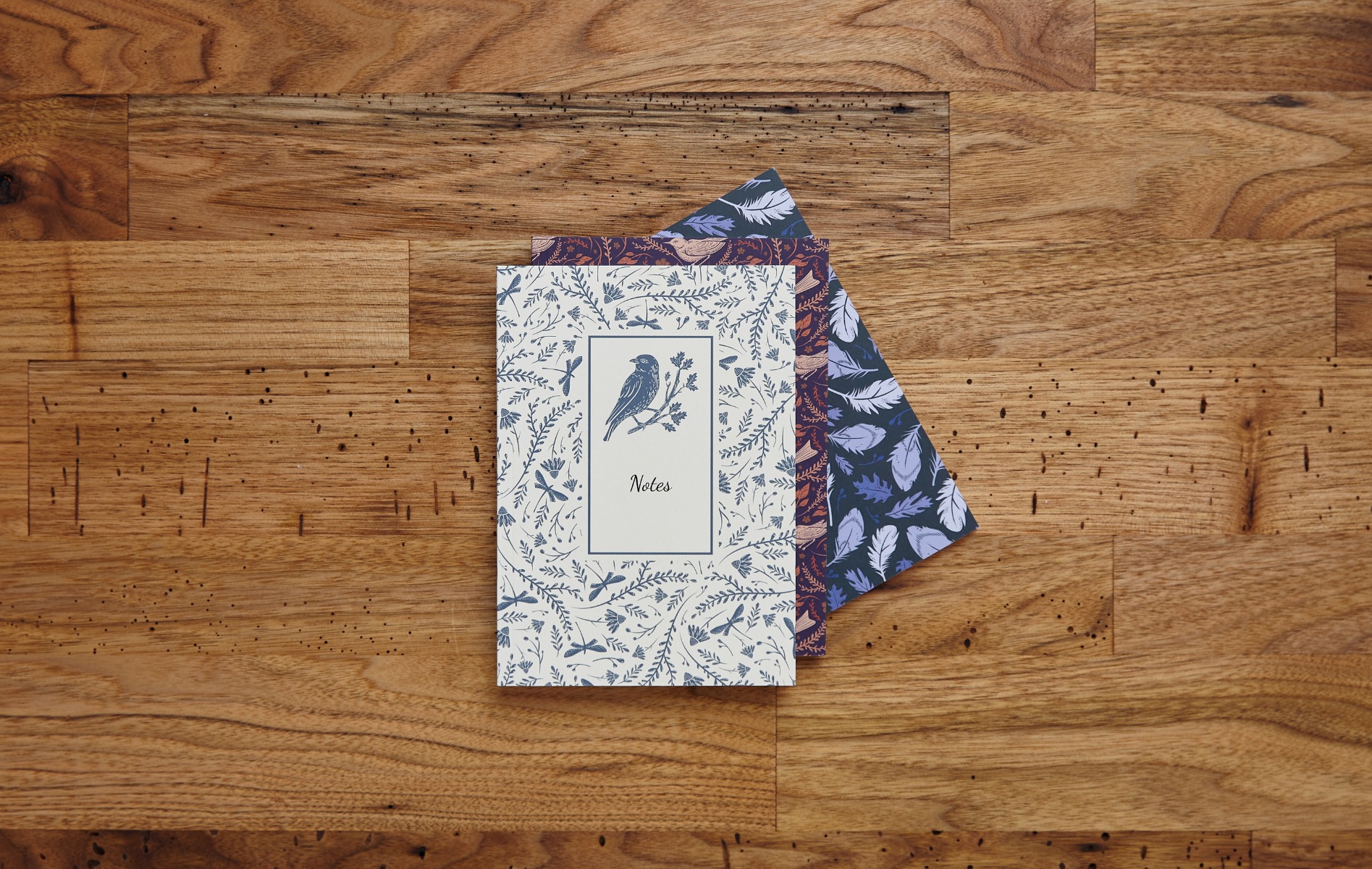 two stacked custom journals on coffee table